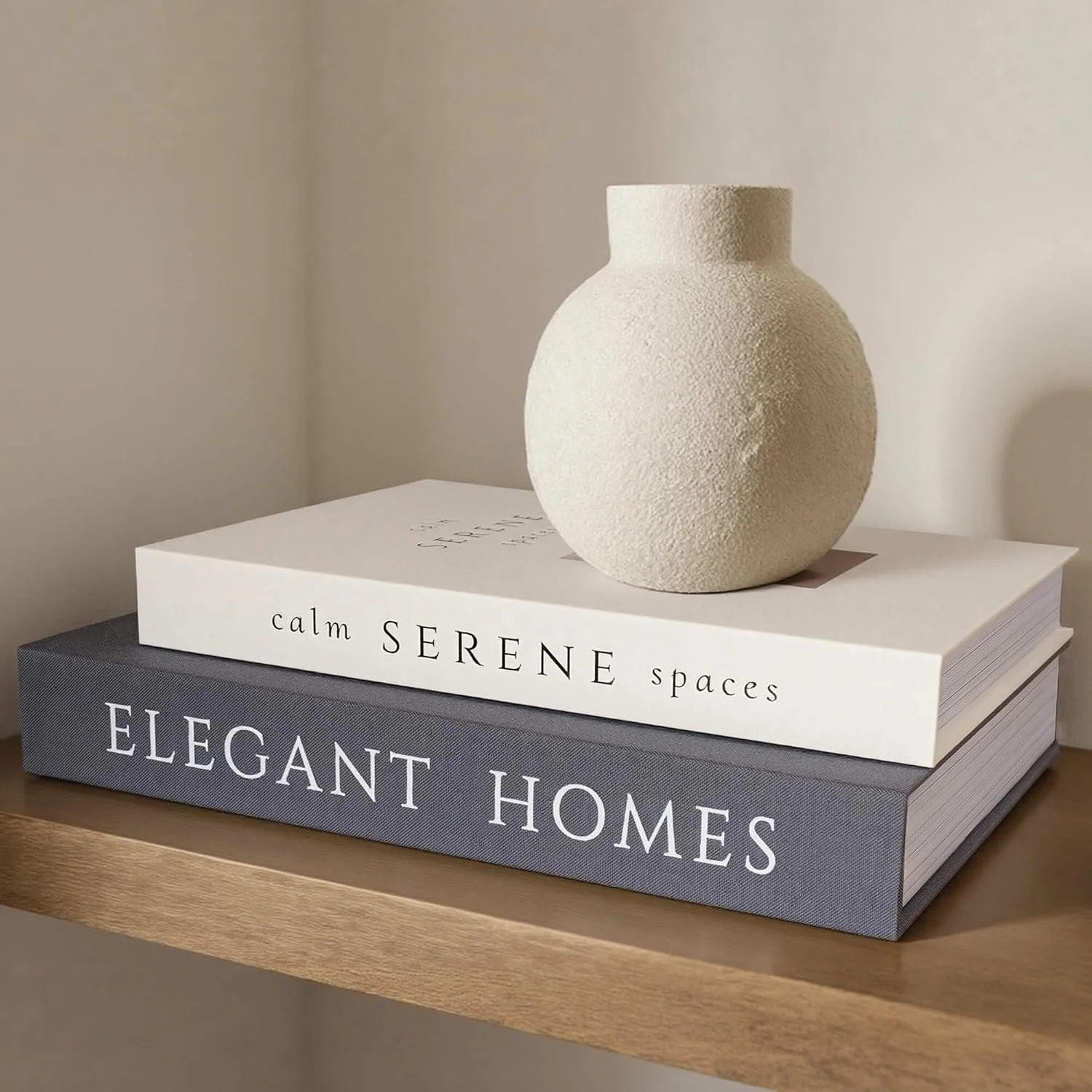 Serene Spaces decorative storage books, Black-beige: stack beneath a vase