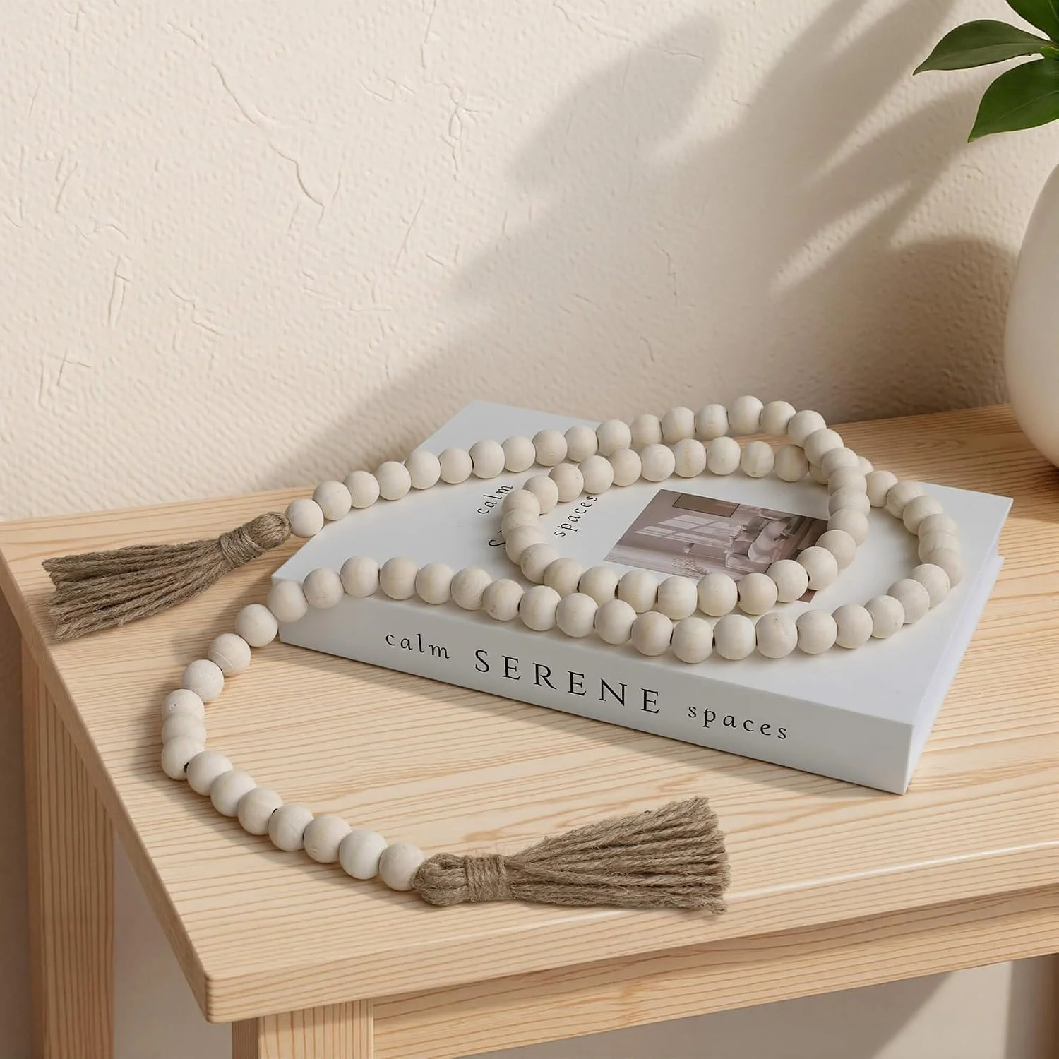 Wood bead garland with tassels, Natural Wood: garland on a shelf