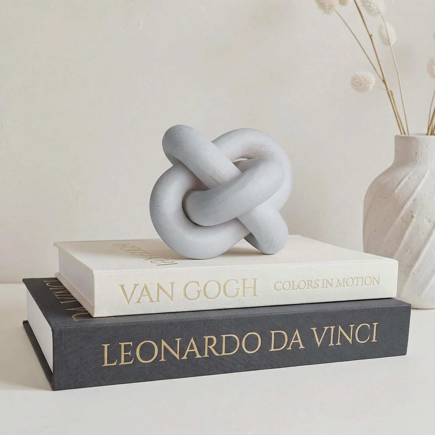 White wood knot sculpture, White: knot on decorative books