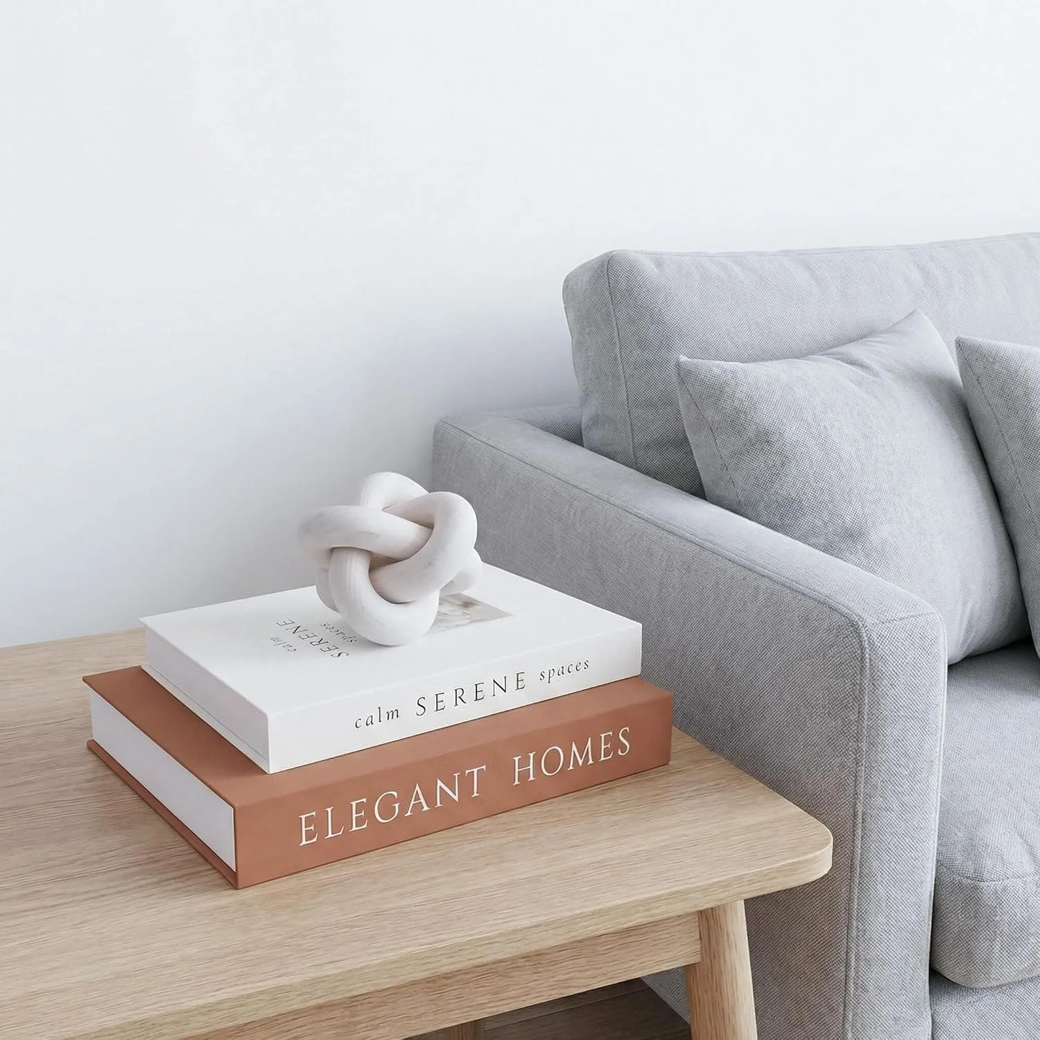 White wood knot sculpture, White: knot on a table