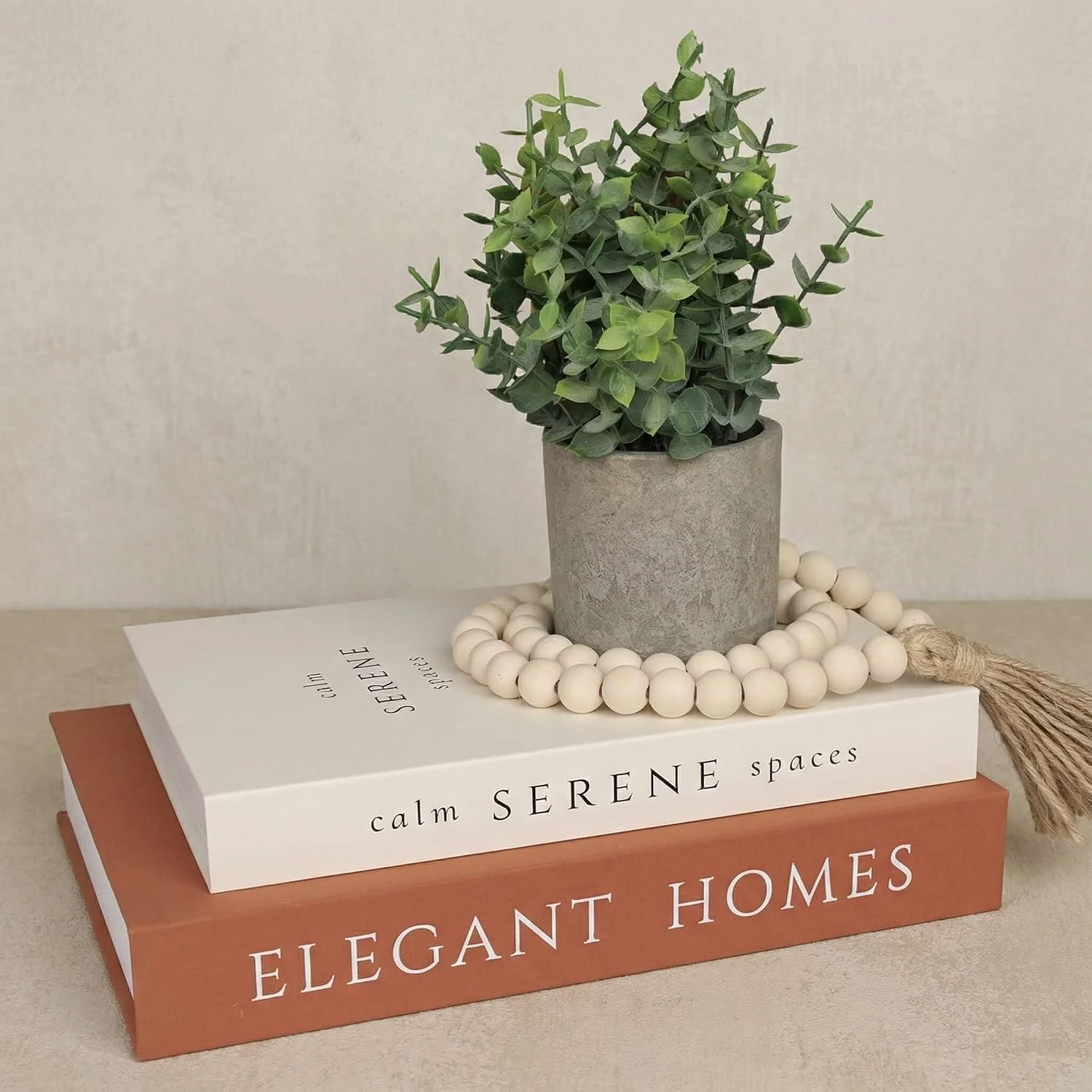 Potted faux eucalyptus pair, Sage Green: plant beside books